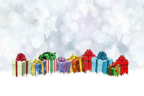 Colorful christmas presents on a snowy background.