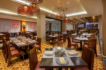 Interior of Los Caporales Mexican restaurant at Moon Palace Cancun with traditional decor and dining tables