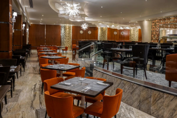 Interior of El Manglar buffet restaurant at Moon Palace Cancun with modern seating and international dining setup