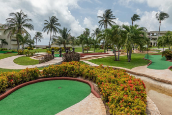 Mini golf course at Moon Palace Cancun with landscaped paths and family-friendly outdoor activity area