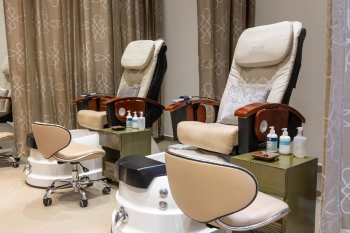 Spa pedicure chairs at Moon Palace Cancun beauty salon with manicure and wellness setup