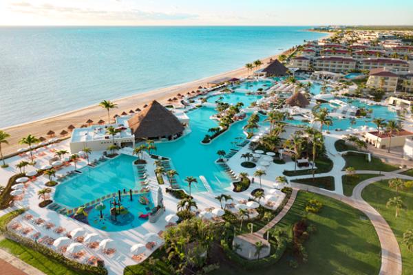 Aerial view of Moon Palace Cancun showing beachfront pools, swim-up bars, and oceanfront resort layout