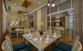 Elegant dining room at Cocotal
restaurant at El Dorado Royale Riviera Maya, serving international breakfast
selections and evening dining.