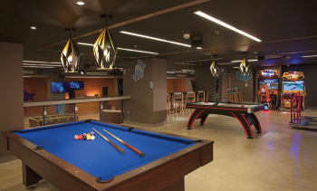 Billiards table and arcade games inside the Core Zone teens club at Dreams Playa Mujeres Billiards table and arcade games inside the Core Zone teens club at Dreams Playa Mujeres